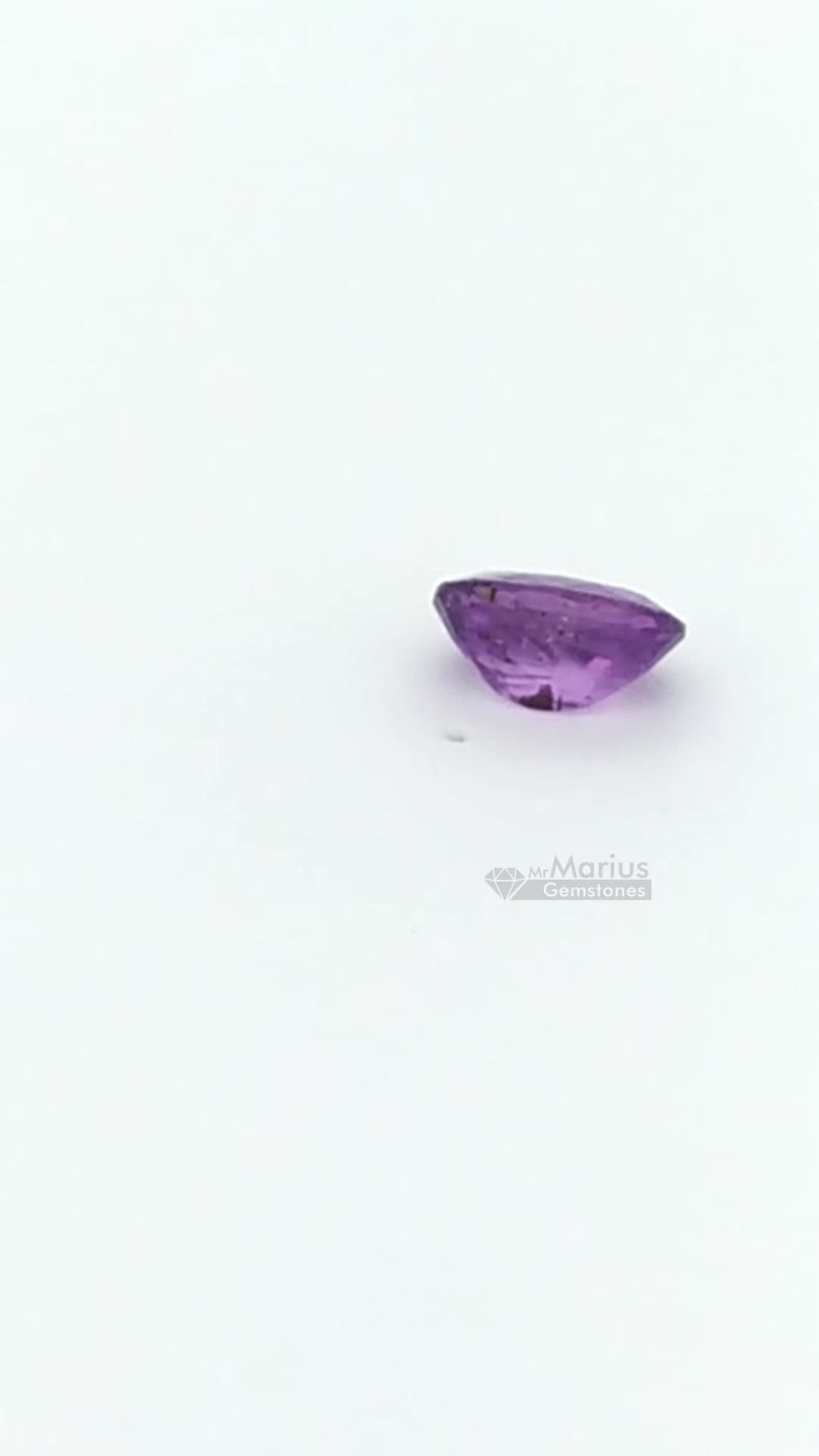 Thumbnail: Unheated purple sapphire with inclusions. oval cut.