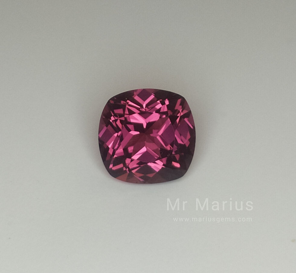 Rhodolite garnet. Front view. Asscher cut. Pinkish red.