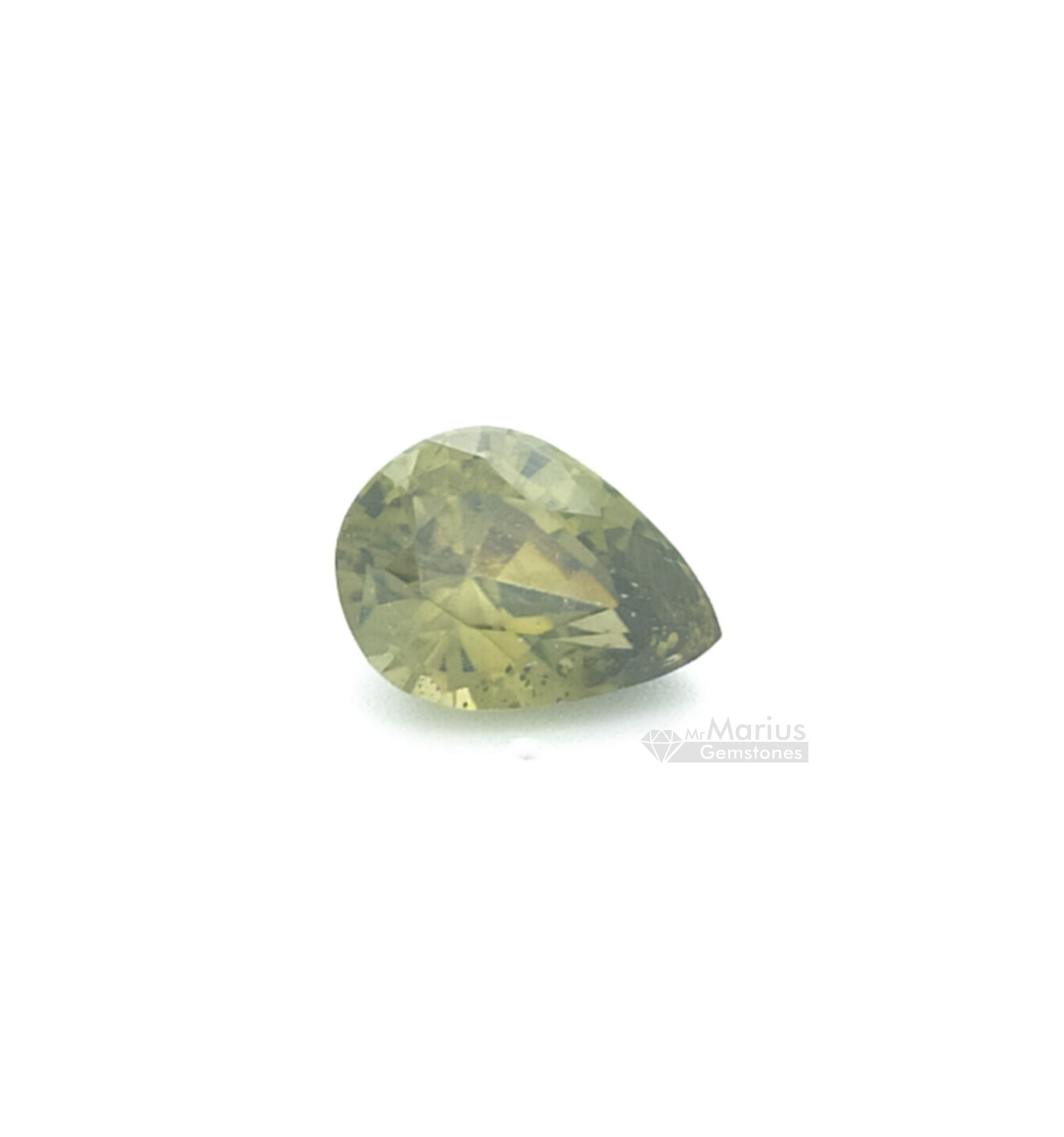 Greenish yellow zircon, pear shaped with some inclusions.