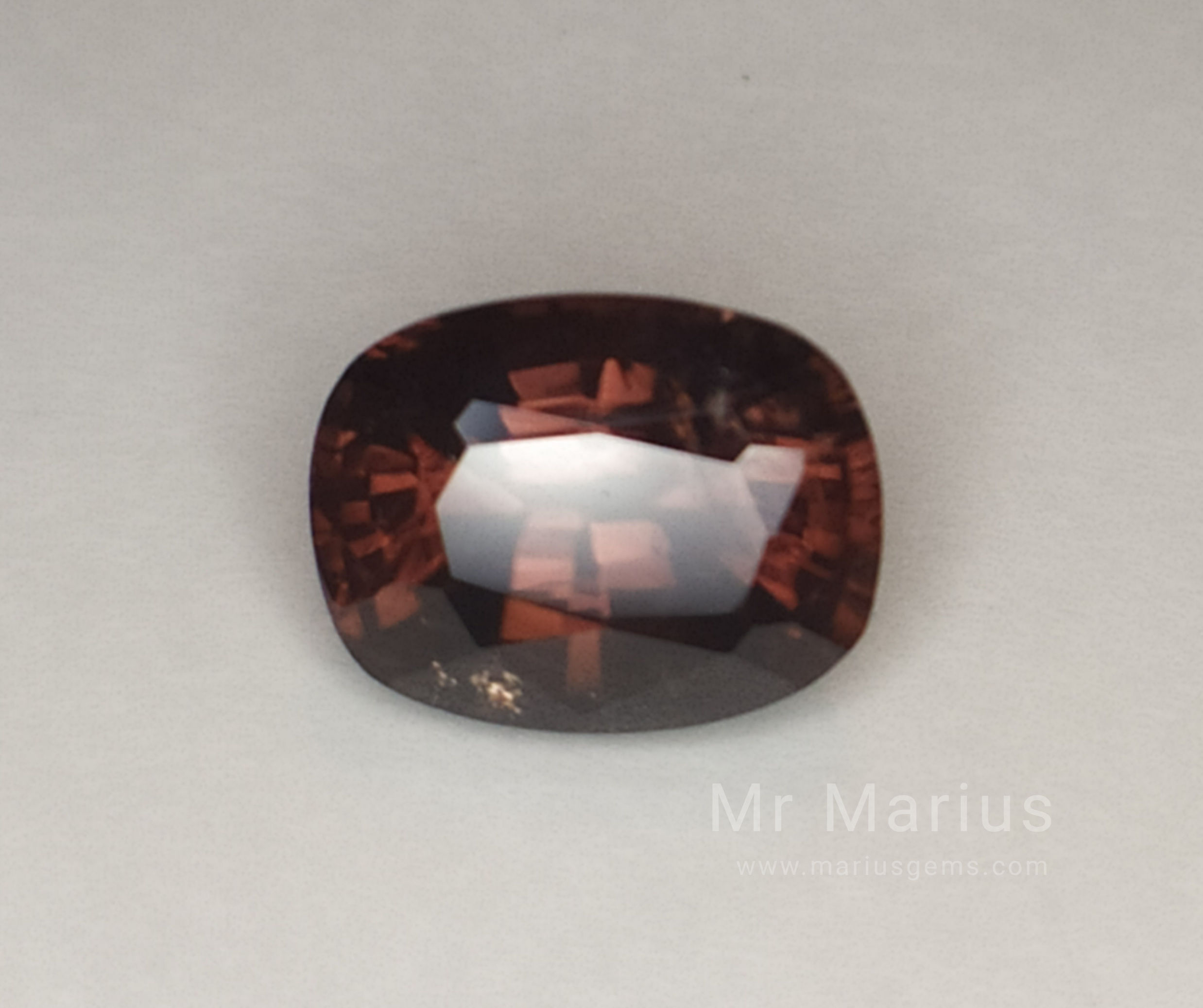 Brown cushion cut zircon. Have inclusions.