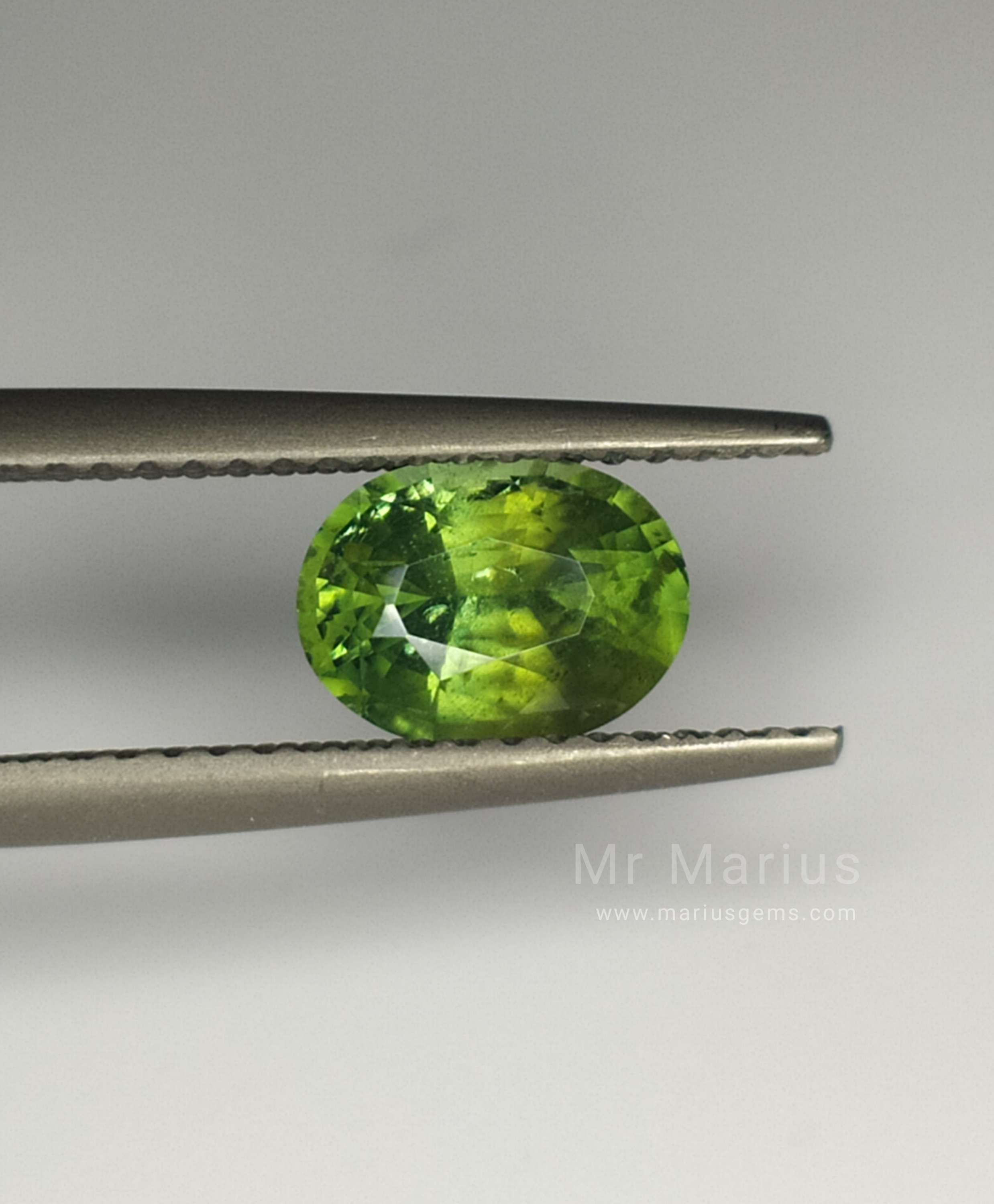 1,65 carat oval cut light green zircon with inclusions.