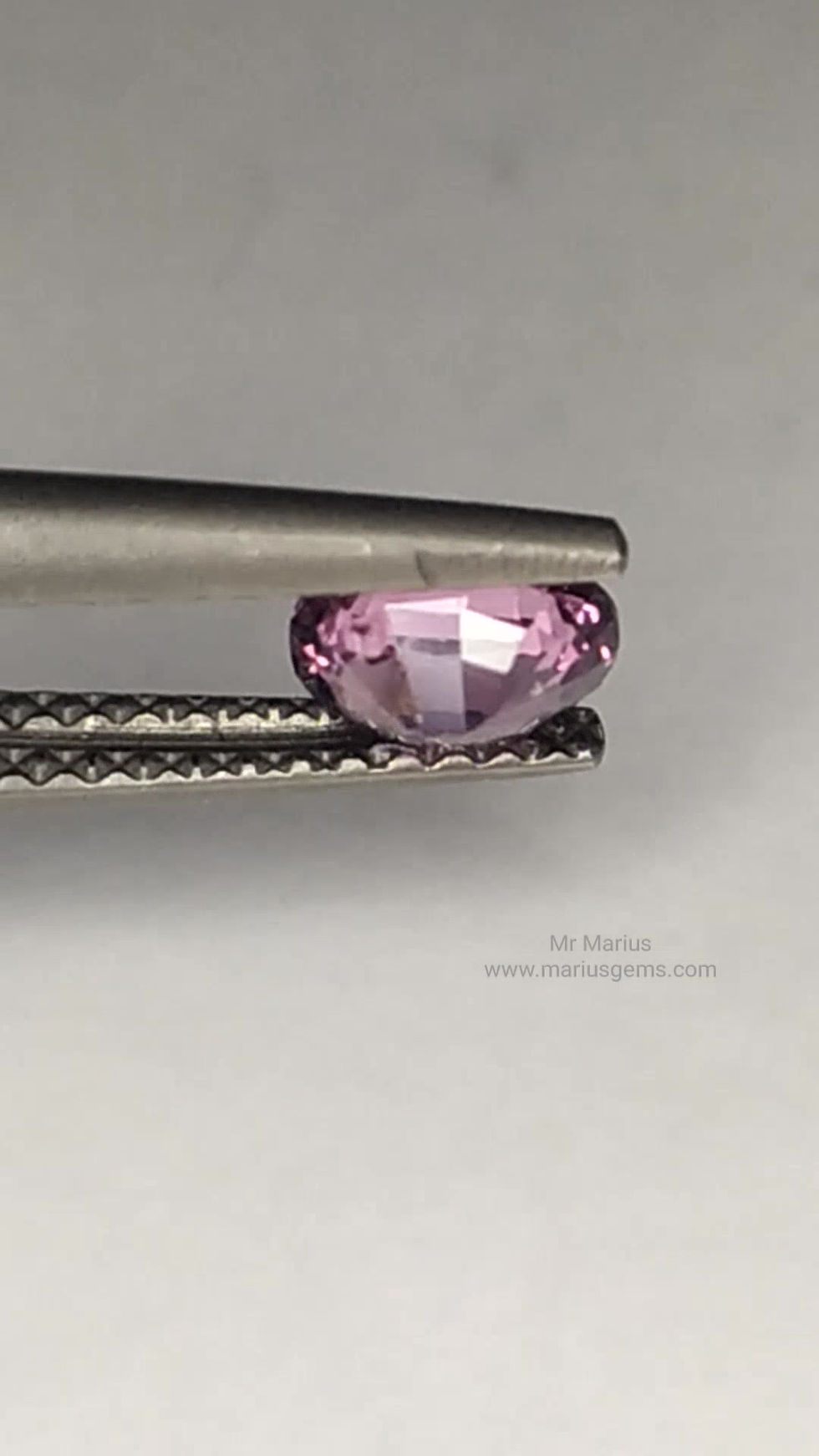 Thumbnail: Cute little milky purplish pink oval cut spinel.