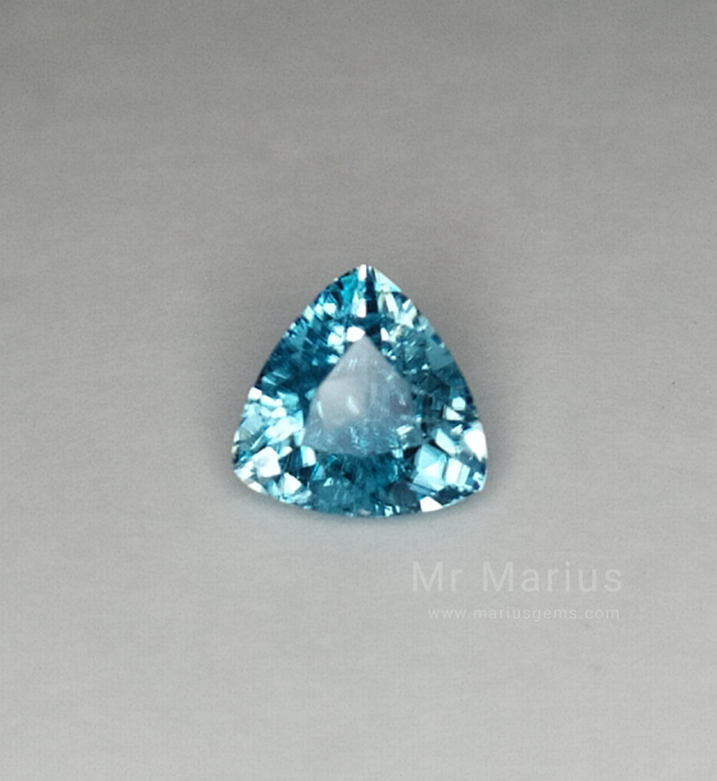 Shiny triangular shaped blue zircon from Cambodia.