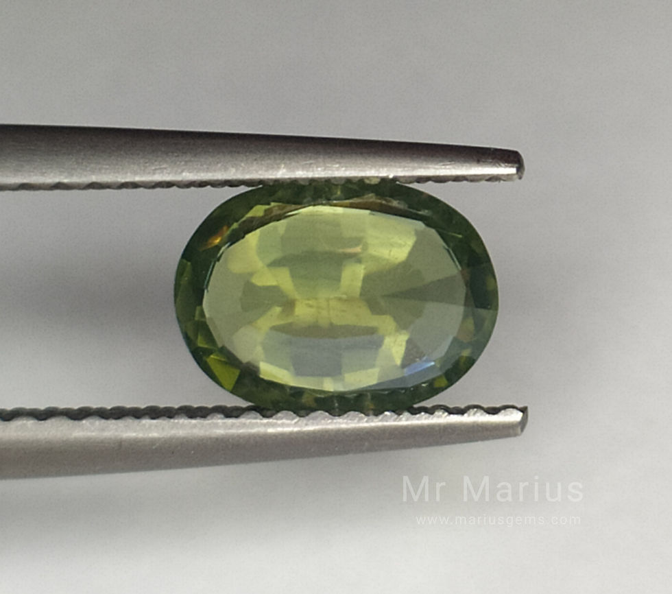 Thumbnail: A pair of green zircons. Oval cut. Pavillion side picture.
