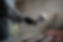 side-view-worker-spraying-powder-paint-from-gun.jpg