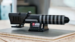 Official LEGO Star Wars 40917 The Darksaber GWP set showing brick-built hilt and display stand