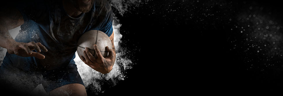 Close-up of a muddy rugby player sprinting with the ball, surrounded by smoky textures and motion blur, capturing action, power, and drive in sport.