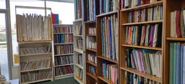 Simple Sewing Fabric Shop Fabric on shelves inside Napa Sew and Vac