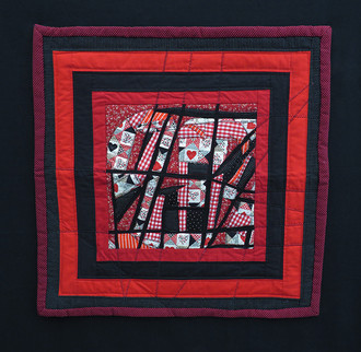 Queen of Hearts Quilt Zig Zag Fabric Collage with black and red boarders