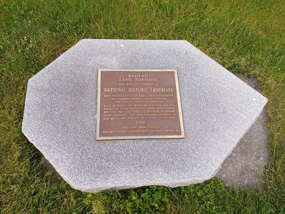 An historical marker at Lake George Village commemorating the HMS Land Tortoise. Photo from Tim Dusablon.