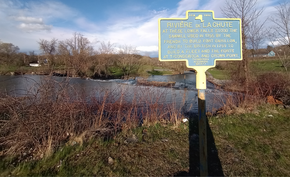 An historical marker denoting the location of the sawmill, originally built by the French, at the falls of the La Chute River in Ticonderoga. Photo from Tim Dusablon.