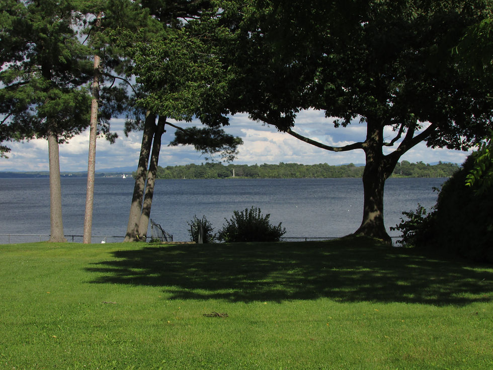 A view from Cliff Haven, where the French fleet was abandoned and repurposed by the British. Crab Island is in the distance, with the monument visible honoring the approximately 150 British and American soldiers from the Battle of Plattsburgh in the War of 1812. Photo from Tim Dusablon.