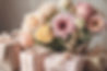 Soft colored flowers and wrapped presents.jpg