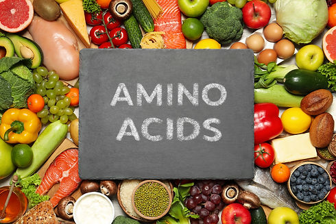 Different organic products and slate board with text AMINO ACIDS, top view .jpg