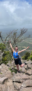 Woman on top of mountain
