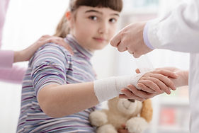 doctor-wrapping-a-bandage-on-a-girl-s-wrist-2025-01-08-04-59-31-utc.jpg