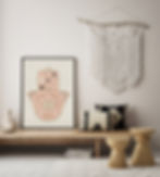 Boho room with hamsa art print in a neutral color palette and a macremé wall hangin