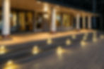 Composite Deck image at night with riser lights railing