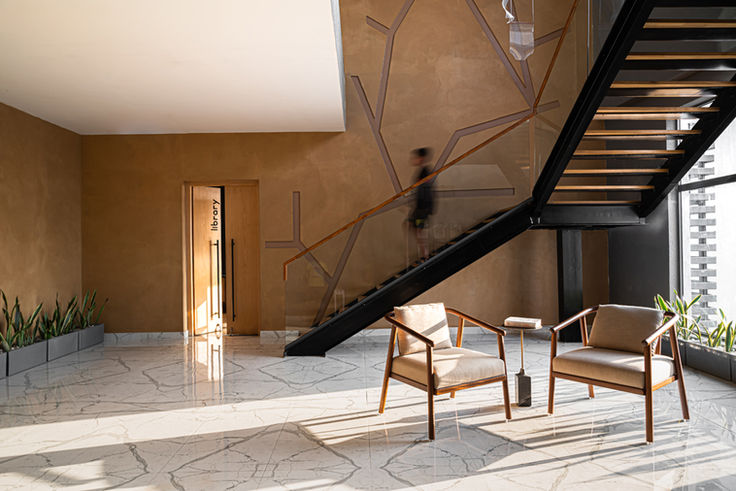 best design of a residential club with a steel staircase designed by square in kokata