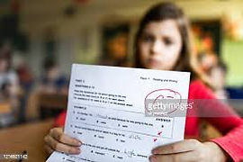 girl with report card.jpg