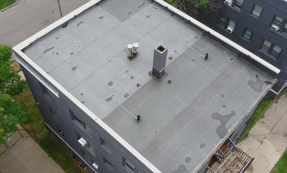 EPDM rubber commercial flat roof installed by New Vista Exteriors in Des Moines metro