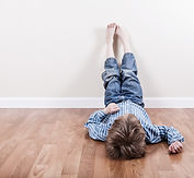 Toddler chair tipped over, toy blocks scattered around