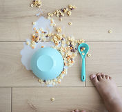 Spilled breakfast cereal on floor representing child behavioural concerns