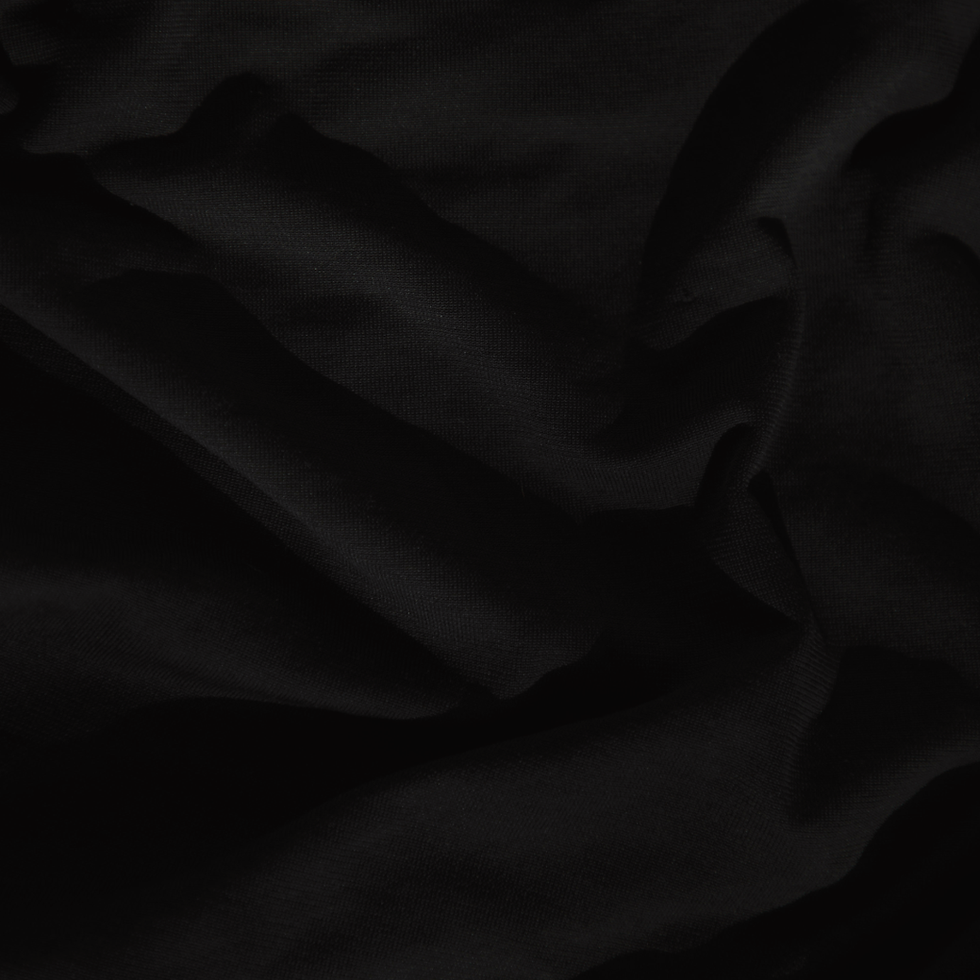Background image with a black texture that looks like fabric or sand.