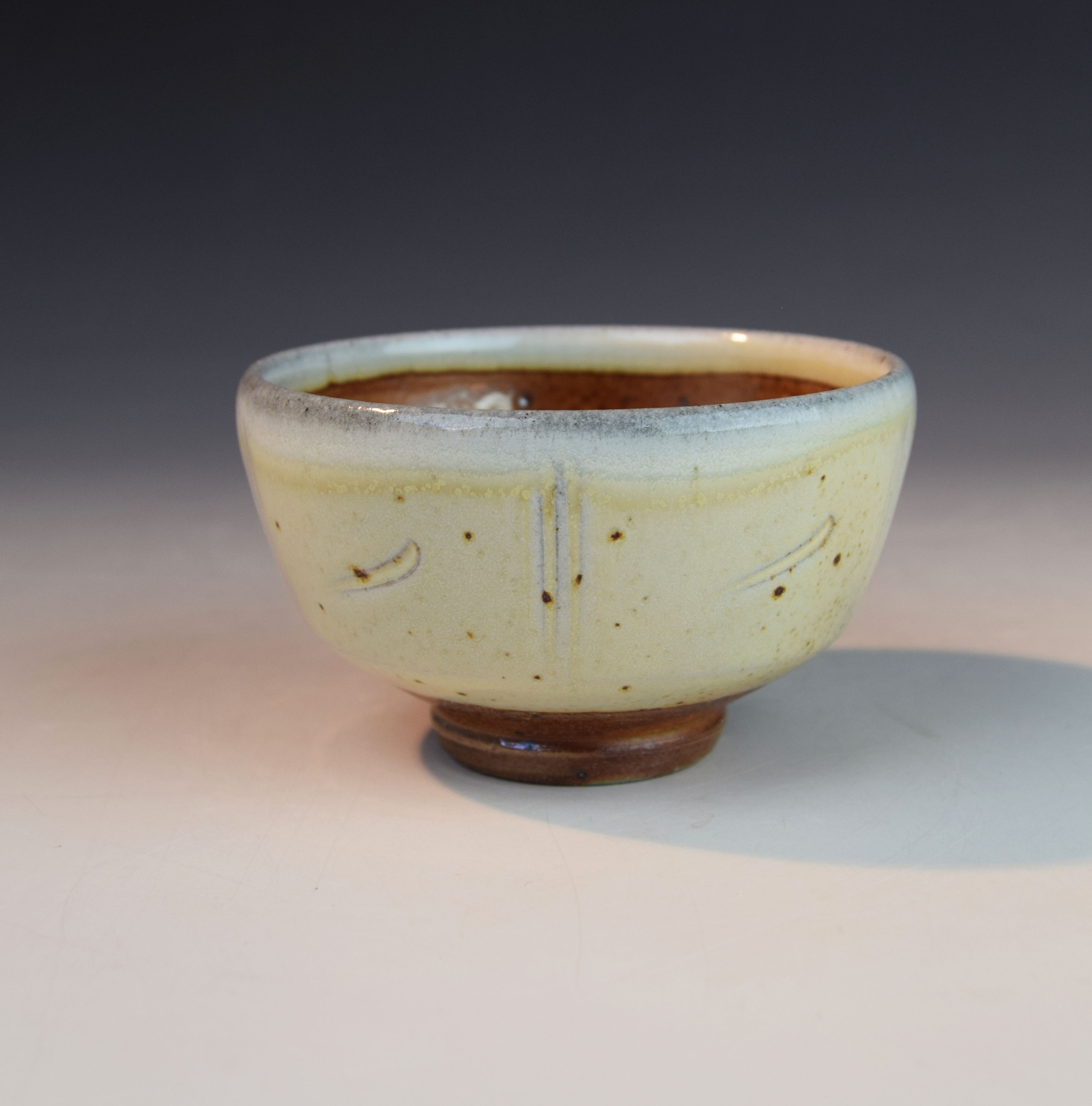 Soda fired open tea bowl