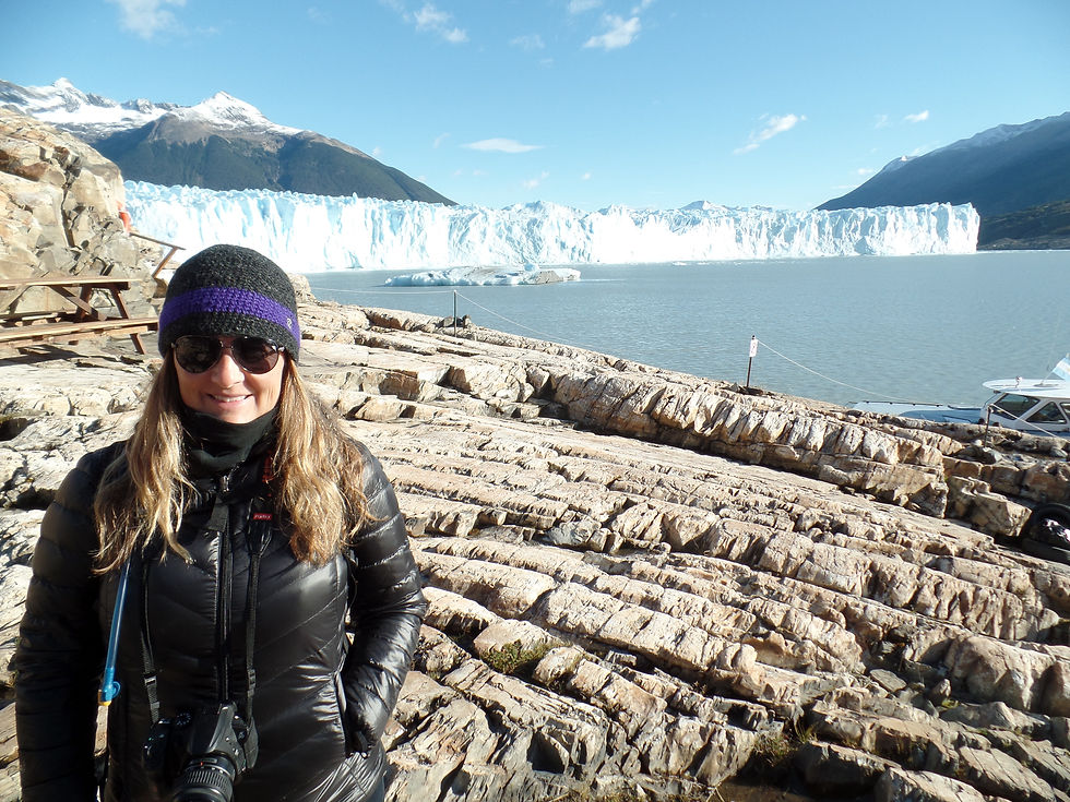 Michelle in front of glacier taking a photo