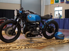 Parker Zamarelli's BMW R100 airhead bobber on display at a motorcycle show.