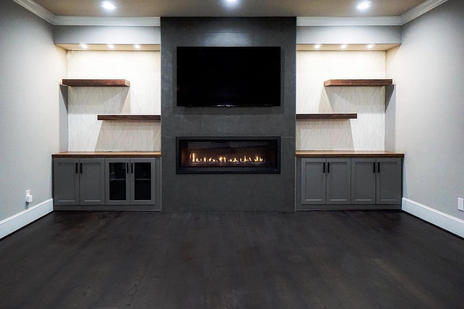 an entertainment center with floating shelves