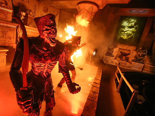 The Mummy skeleton surrounded by intense flames and dramatic lighting.Revenge of the Mummy indoor fire effects and intense ride scene at Universal Orlando during Halloween Horror Nights, showcasing one of the attractions open during the event.