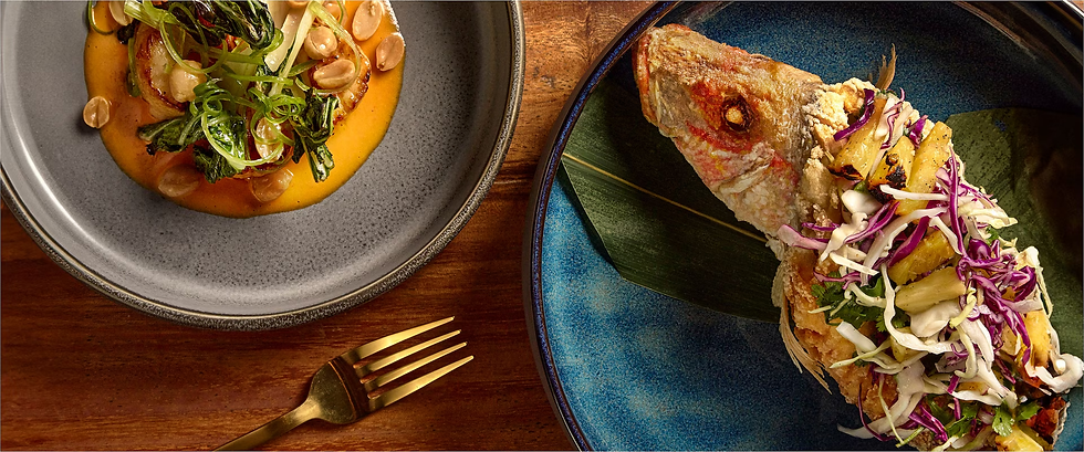 Gourmet seafood dish and artfully plated Caribbean cuisine at Sandals Resort specialty restaurant, highlighting fine dining options included in Sandals all-inclusive luxury experience planned with Sandals specialist travel advisor Brandi Parker.