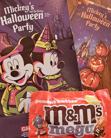 Exclusive Mickey’s Not-So-Scary Halloween Party candy and treats featuring Halloween-themed M&M’s packaging.
