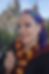 Brandi Parker at The Wizarding World of Harry Potter in Universal Orlando, holding a wand in front of Hogwarts Castle, showcasing firsthand Universal Parks expertise as a Certified Universal Parks and Resorts Specialist with Magical Moments Vacations.