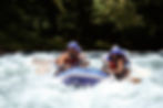 “Adventures by Disney guests white-water rafting on a fast-moving river in Costa Rica, wearing helmets and life vests as they paddle through rapids surrounded by lush tropical rainforest. Family-friendly Costa Rica adventure vacation with guided outdoor excursions and adrenaline-filled activities included on Adventures by Disney itineraries.”
