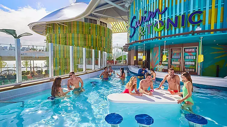 Royal Caribbean Icon of the Seas Swim & Tonic swim-up bar featuring guests enjoying cocktails in a pool with in-water seating, vibrant tropical design, and social atmosphere, highlighting unique cruise ship bar experiences and adult-friendly amenities.