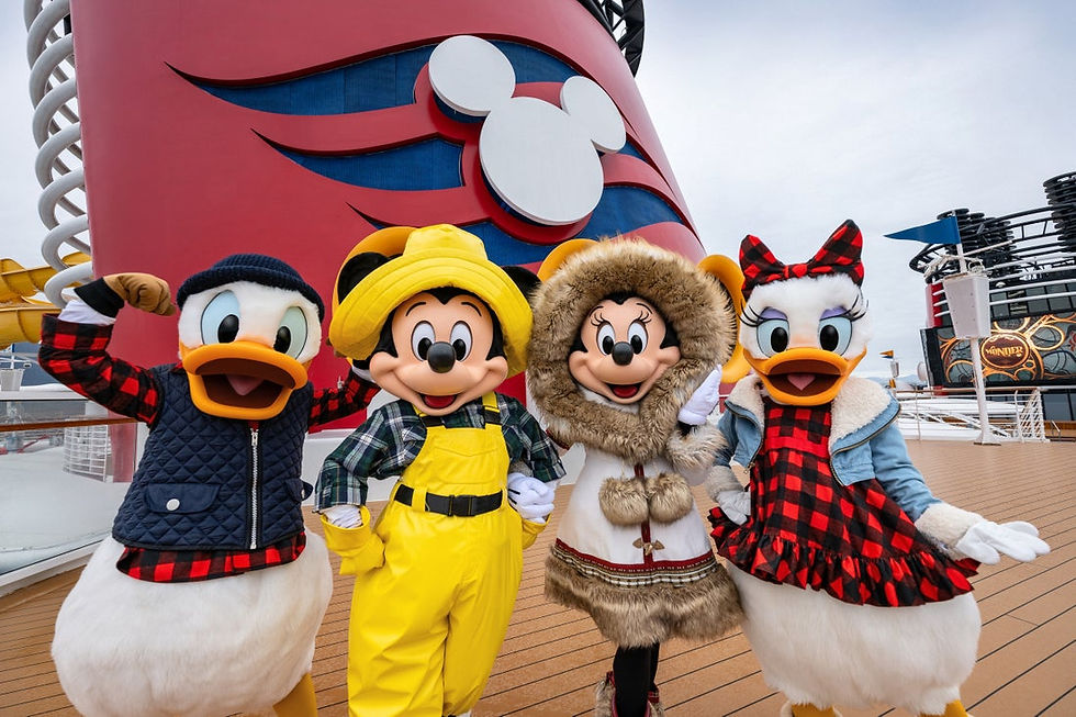 Mickey Mouse, Minnie Mouse, Donald Duck, and Daisy Duck in winter outfits posing on a Disney Cruise Line deck.