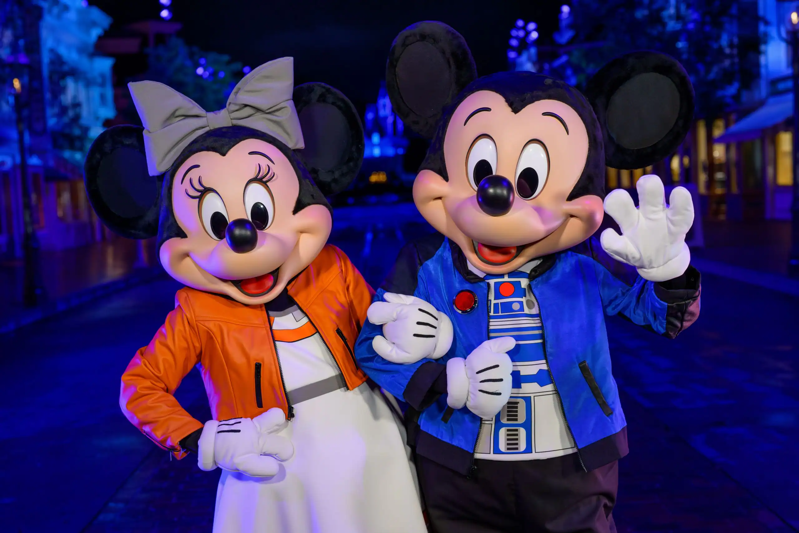 Mickey dressed in an R2-D2–inspired jacket and Minnie dressed in a Princess Leia–inspired outfit for Disneyland After Dark: Star Wars Nite, posing together during the 2026 after-hours event at Disneyland Resort.