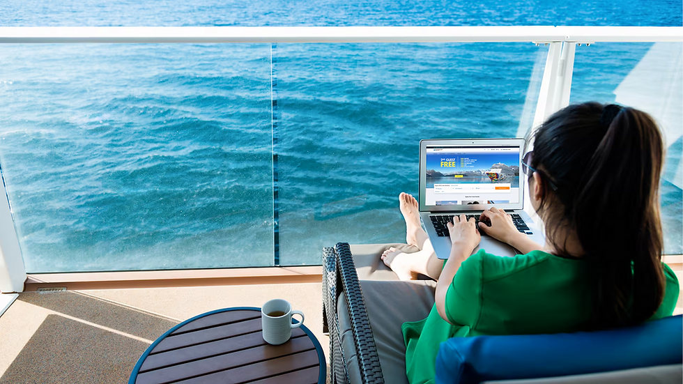 Woman relaxing on a private cruise ship balcony while working on a laptop overlooking turquoise ocean waters, with a coffee mug nearby and glass railing framing the sea view, illustrating the freedom to stay connected at sea. Curated by Brandi Parker, Certified Cruise Specialist, specializing in Norwegian Cruise Line vacations and expertly planned NCL sailings that highlight Free at Sea perks, onboard Wi-Fi access, and flexible cruise experiences for modern travelers.