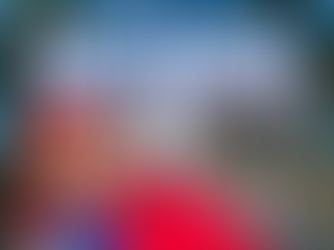 Promotional image for Universal Studios Hollywood showing the park entrance lined with palm trees and a red carpet leading toward the iconic archway, with Super Mario waving in the foreground. Large overlay text reads “Universal Hollywood February Promos,” highlighting limited-time Universal Studios Hollywood vacation deals. The image represents immersive theme park experiences including Super Nintendo World, movie-based attractions, family-friendly rides, and expertly planned Universal Hollywood vacations curated by Brandi Parker of Magical Moments Vacations.