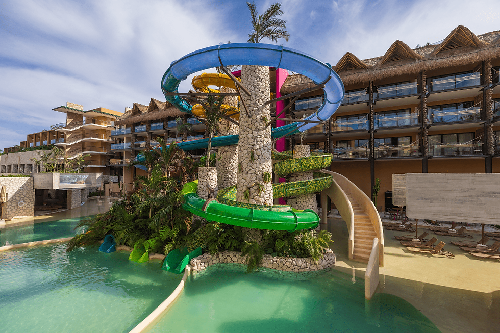 Hotel Xcaret México family water park with multi-level waterslides, eco-integrated pools, and all-inclusive resort fun for kids and adults in Riviera Maya.