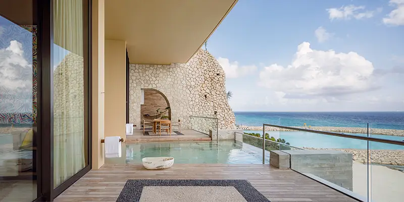 La Casa de la Playa private terrace with plunge pool, stone architecture, and oceanfront views, showcasing ultra-luxury adults-only all-inclusive resort, exclusivity, and personalized Riviera Maya escape.