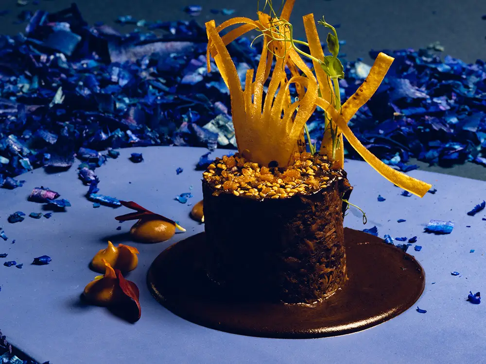 Gourmet dessert presentation at La Casa de la Playa featuring artistic plating, chocolate textures, and modern Mexican culinary artistry in a luxury dining experience.