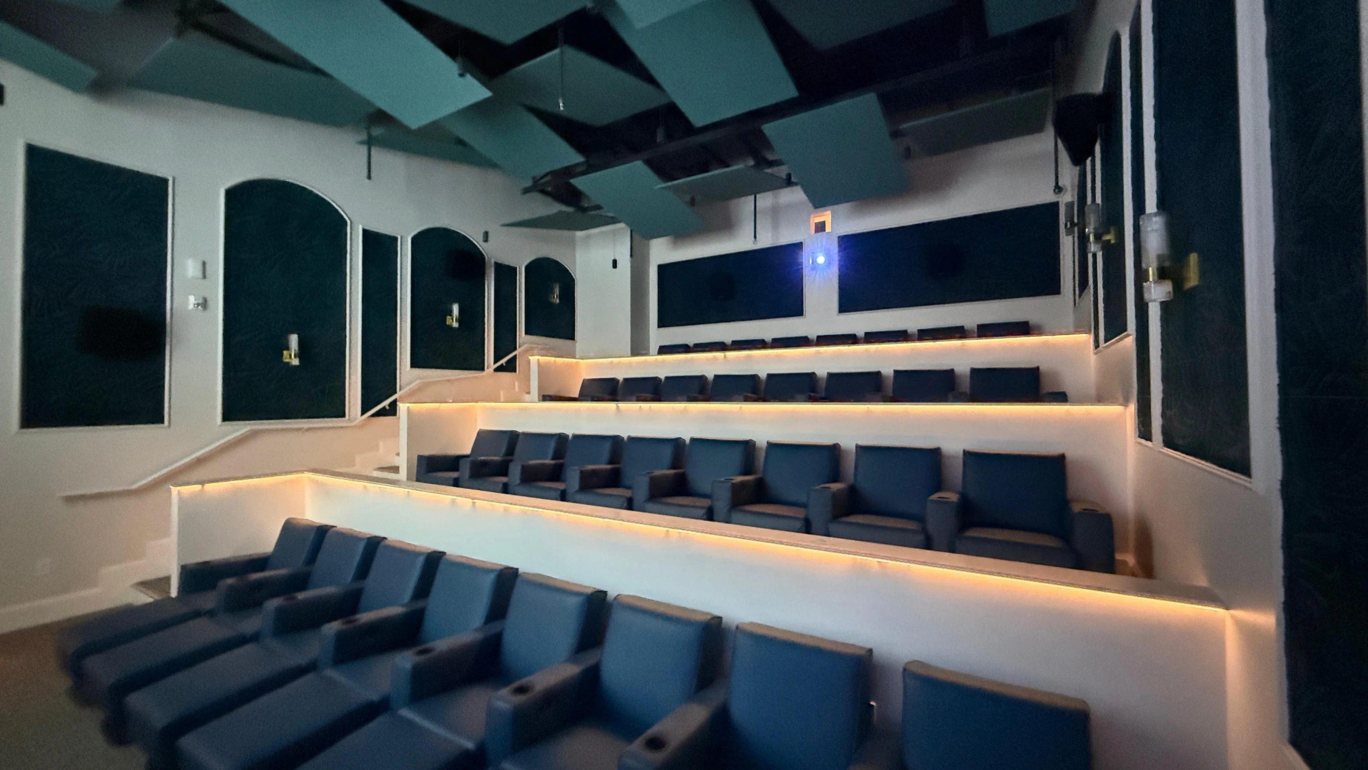 Beaches Turks & Caicos private cinema seating with tiered recliner chairs and ambient lighting, showcasing family-friendly indoor entertainment at the all-inclusive resor