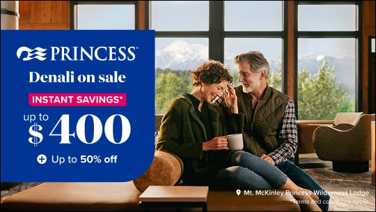 Princess Cruises “Denali on Sale” promotion graphic showing instant savings up to $400 and up to 50% off. Image features a couple relaxing inside Mt. McKinley Princess Wilderness Lodge, sipping coffee while seated near large windows overlooking snow-capped Denali mountain views and lush Alaska wilderness. Warm, cozy lodge interior with natural light.