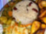 Curry chicken with white rice and beans with veggies and plantains