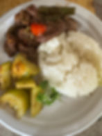 Cube beef with tomato sauce with red and green peppers with white rice and cucumber