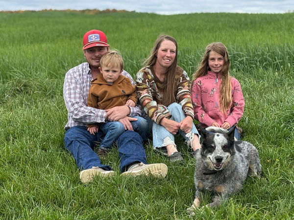 Family sitting with a dog